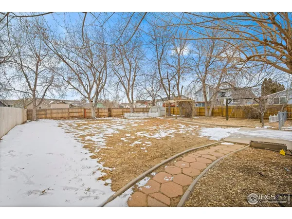 a view of city with snow on the road