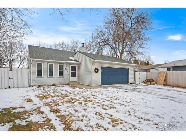 a big house with a tree in front of it