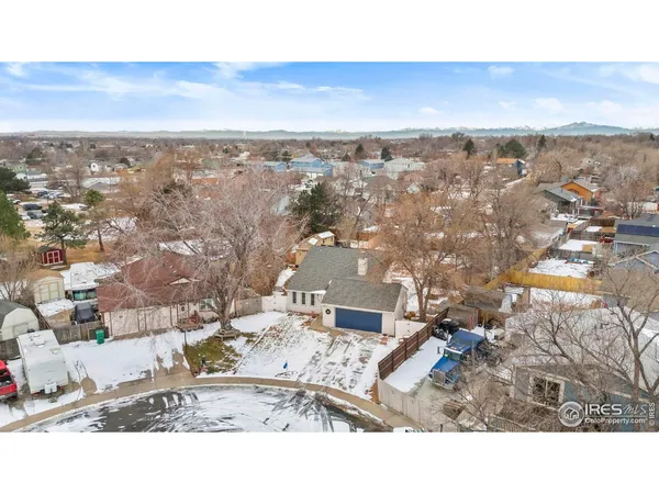 a backyard of a house with wooden fence