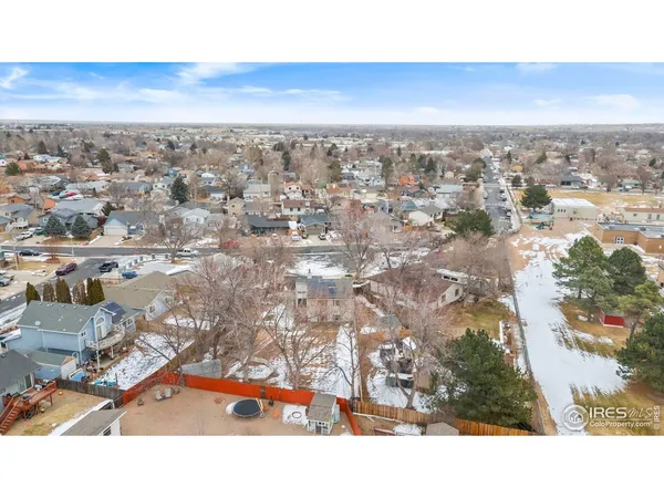 an aerial view of residential building and ocean view