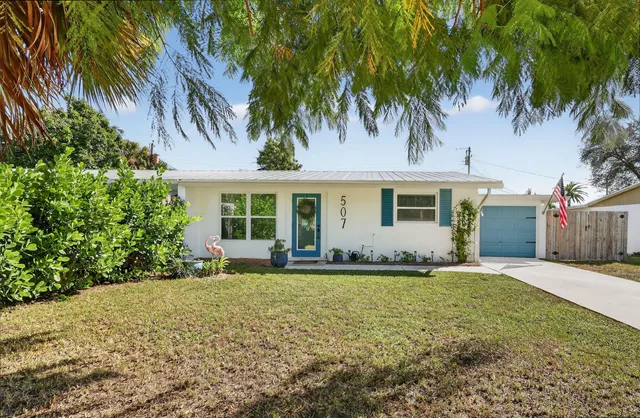 front view of a house with a yard