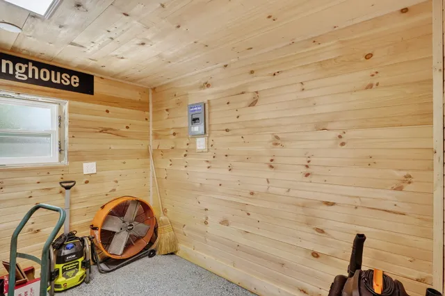 a backyard of a house with table and chairs