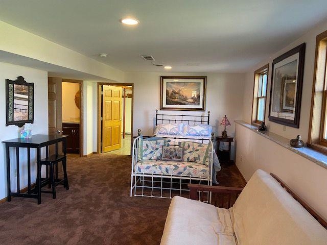 1869 East Town Line Road Oregon, IL 61061 - Photo 13 of 45 a bedroom with furniture and a window