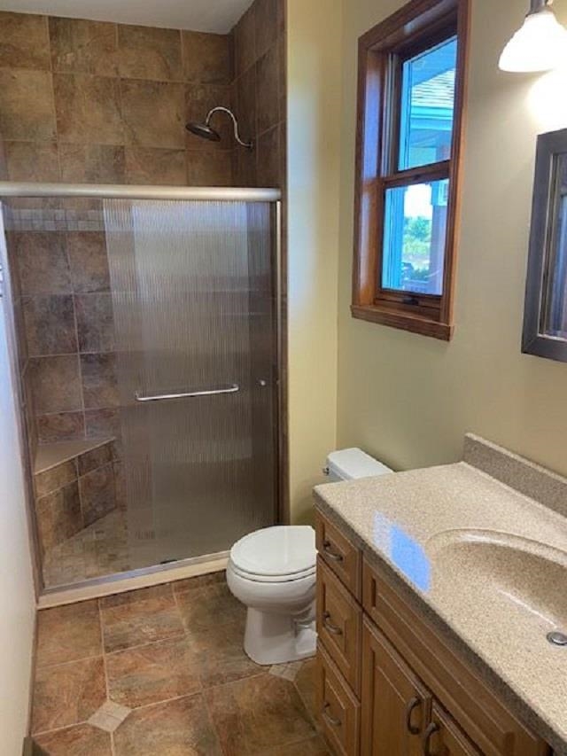 1869 East Town Line Road Oregon, IL 61061 - Photo 18 of 45 a bathroom with a sink a toilet and shower