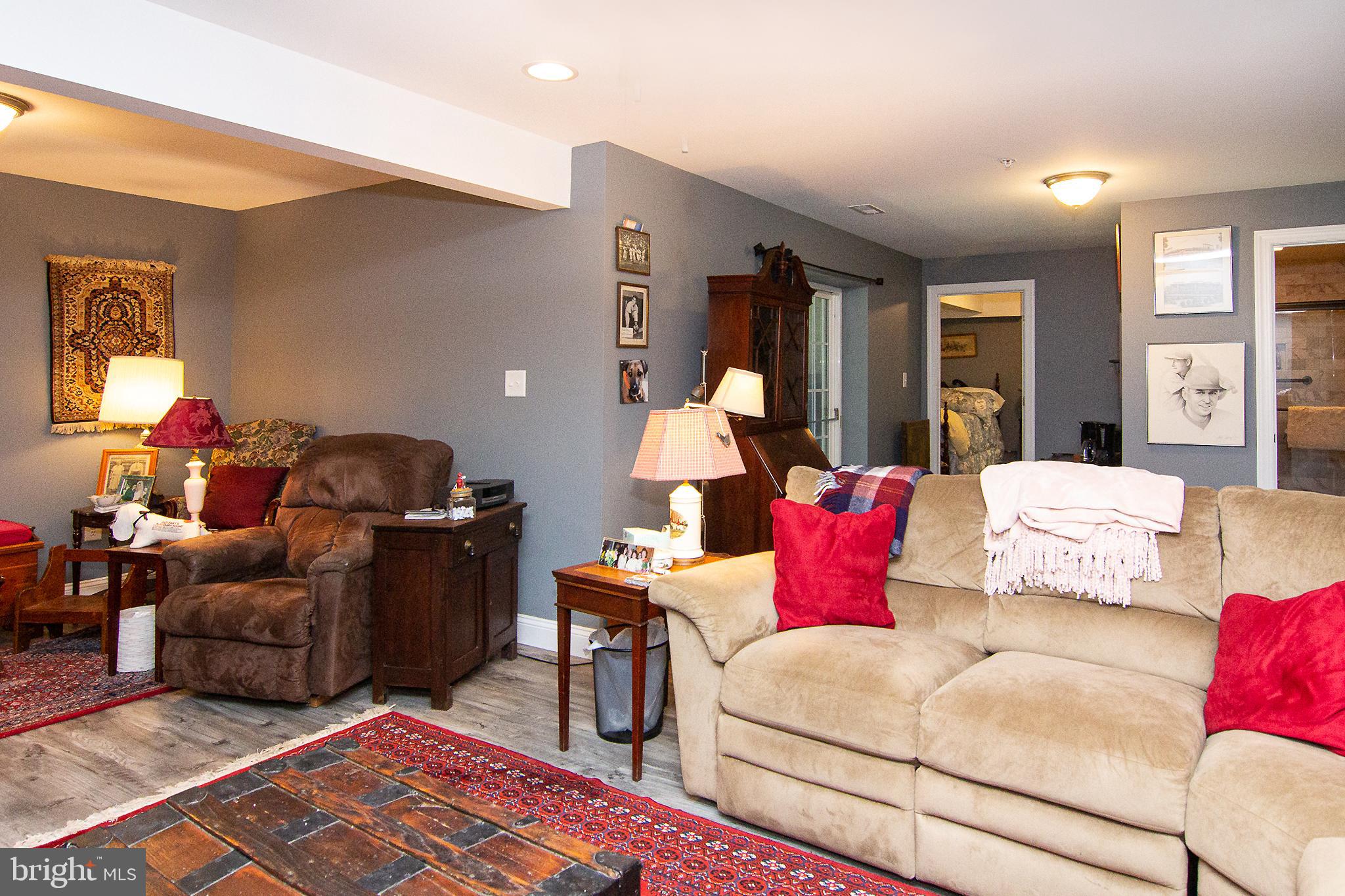 2785 Castlefield Drive, Unit 14 Manchester, MD 21102 - Photo 38 of 42 a living room with furniture rug and window