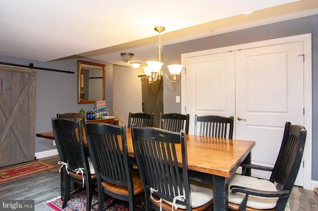 a living room with furniture rug and window