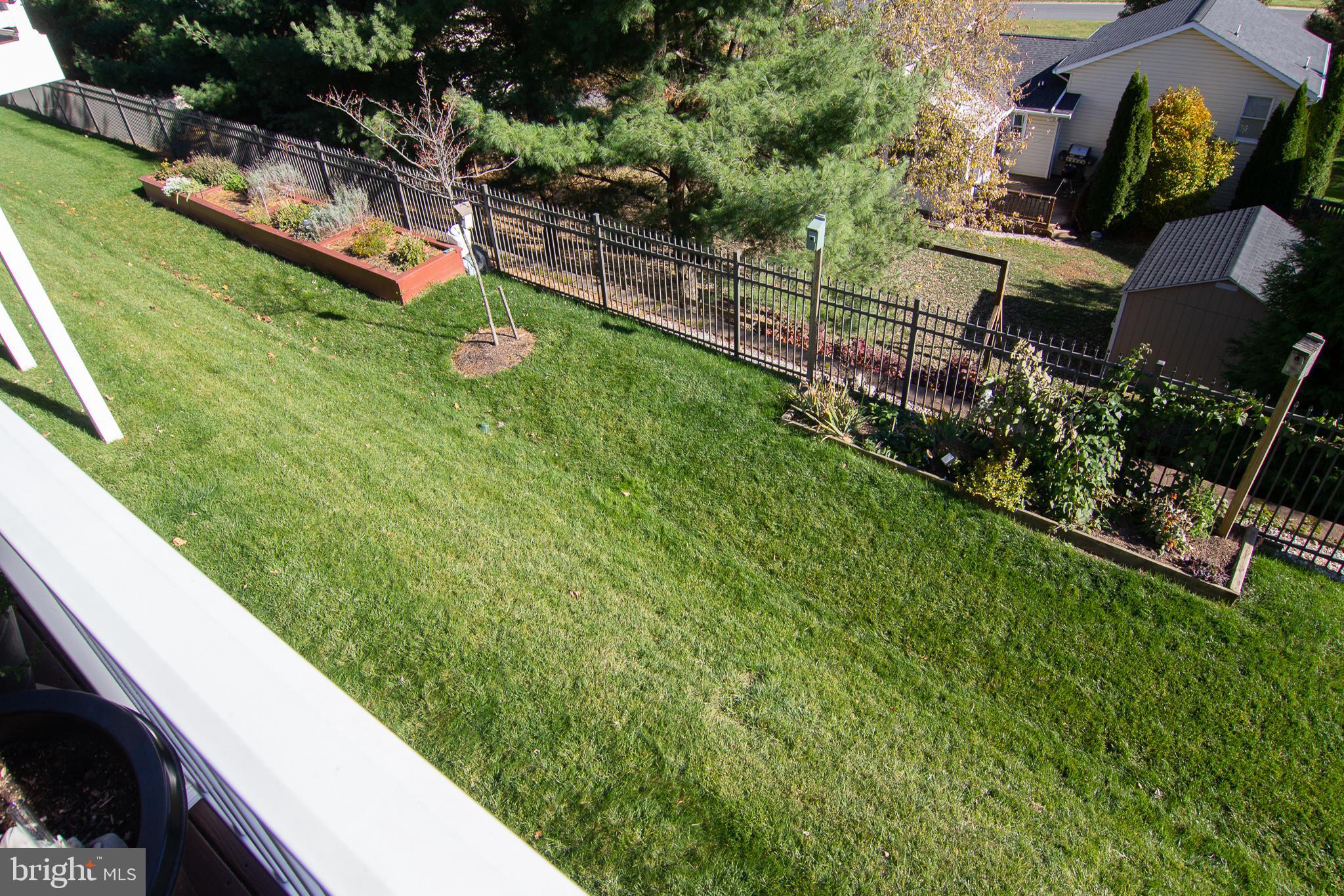 2785 Castlefield Drive, Unit 14 Manchester, MD 21102 - Photo 32 of 42 a view of a backyard with plants