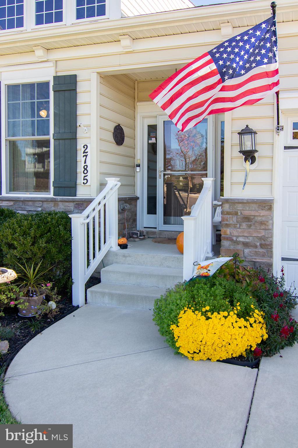 2785 Castlefield Drive, Unit 14 Manchester, MD 21102 - Photo 36 of 42 a view of a house with a patio and a yard