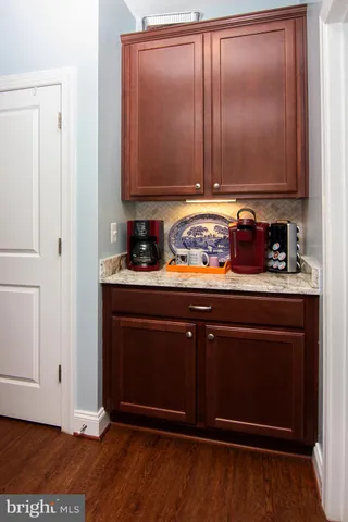 a view of cabinets with wooden floor