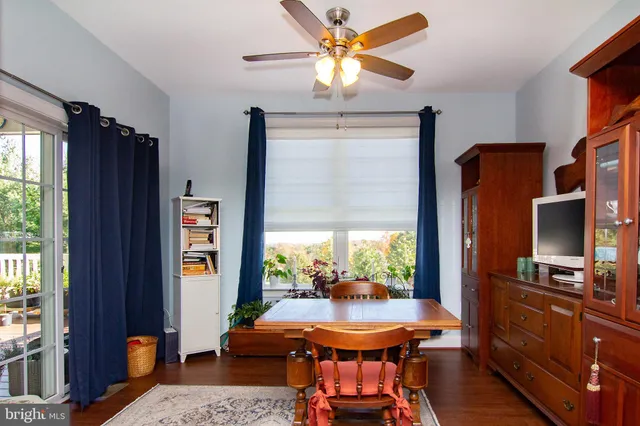 a view of a dining room with furniture window and outside view