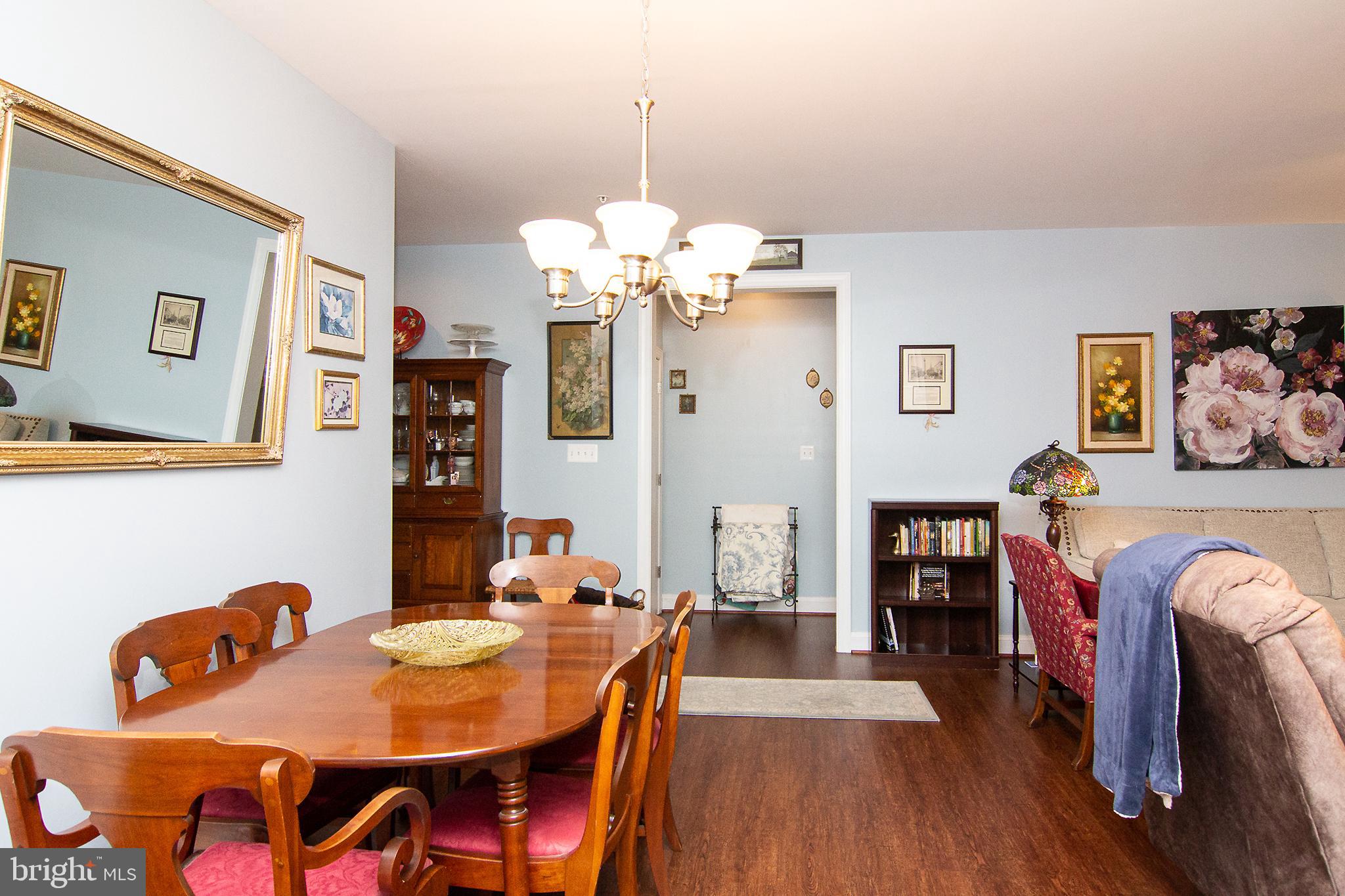 2785 Castlefield Drive, Unit 14 Manchester, MD 21102 - Photo 10 of 42 a view of a dining room with furniture and wooden floor