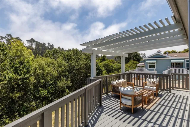 a view of roof deck with furniture