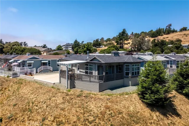 a view of a house with a outdoor space and sitting area