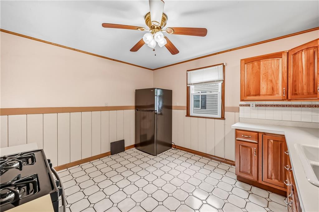 66 Concord Road Hermitage, PA 16148 - Photo 11 of 21 a bedroom with a bed and a chandelier