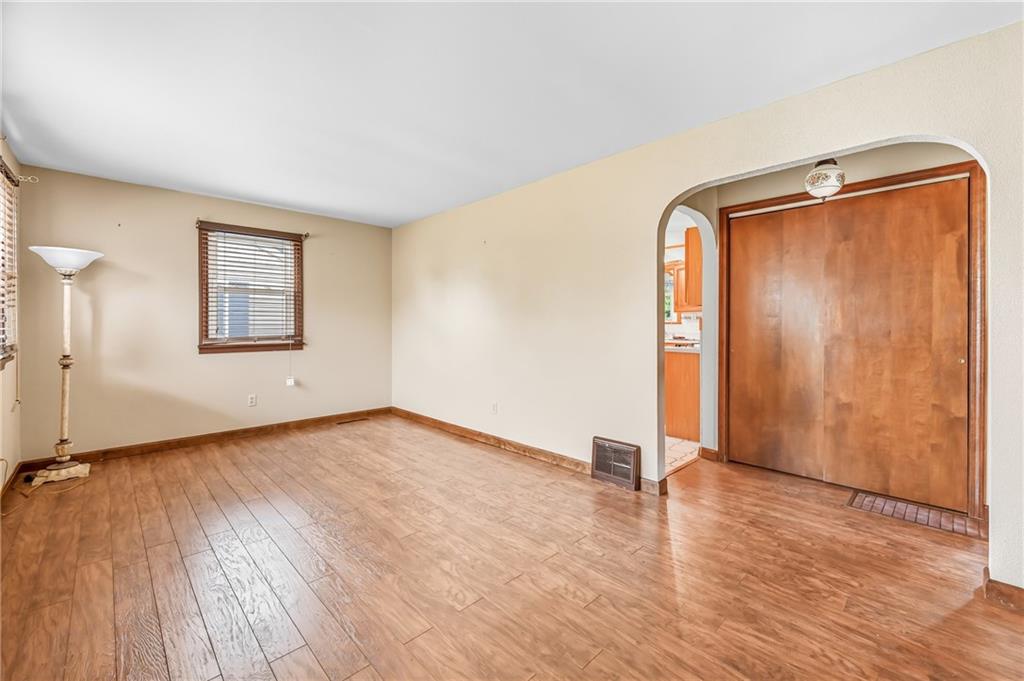 66 Concord Road Hermitage, PA 16148 - Photo 8 of 21 an empty room with wooden floor and windows