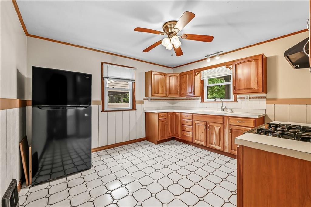 66 Concord Road Hermitage, PA 16148 - Photo 10 of 21 a kitchen with stainless steel appliances a refrigerator and a stove top oven