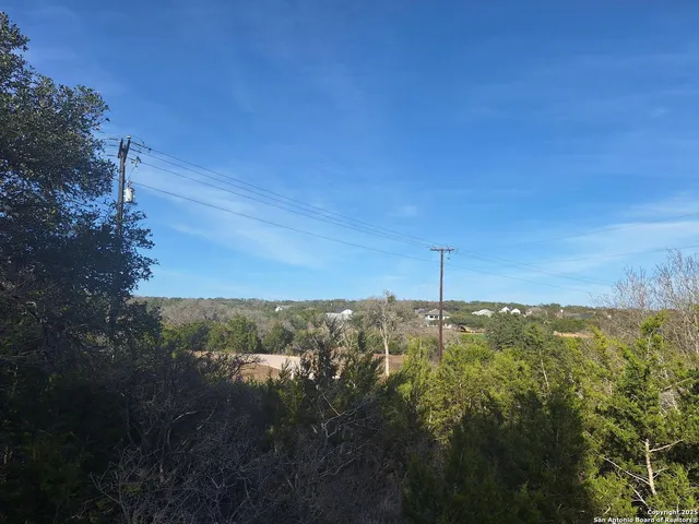 a view of a field with an ocean
