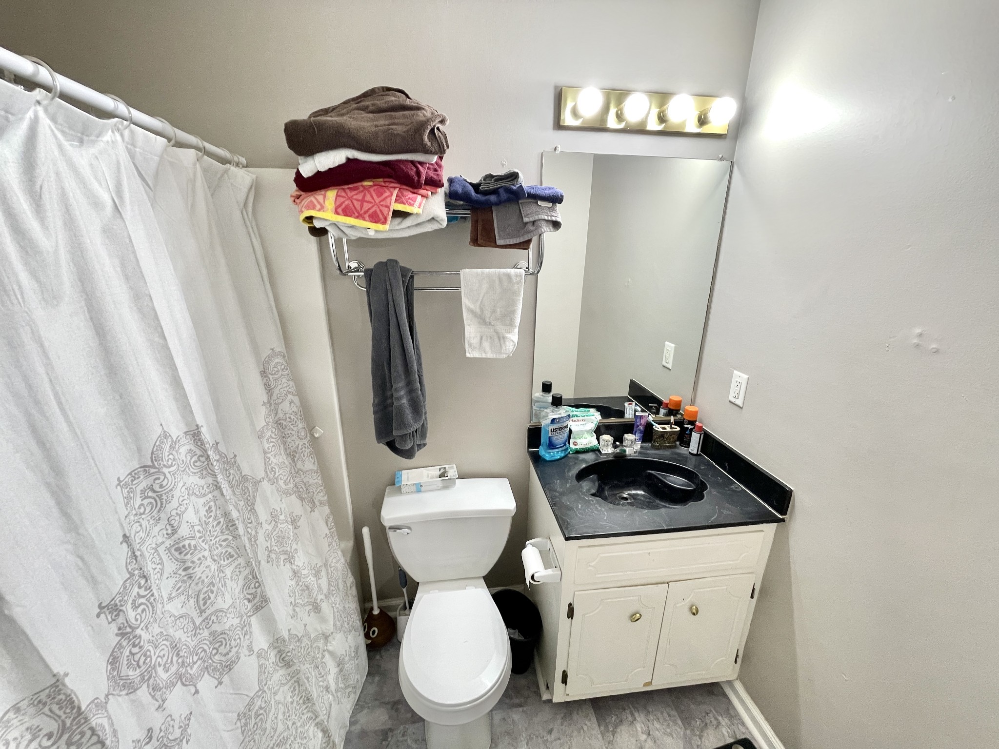 710 Hugh Hunter Road Oak Grove, KY 42262 - Photo 7 of 12 a bathroom with a toilet sink and mirror