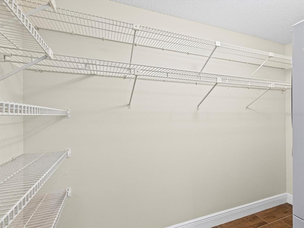 6037 Chesham Drive, Unit 7 New Port Richey, FL 34653 - Photo 24 of 29 a view of a room with racks on the wall