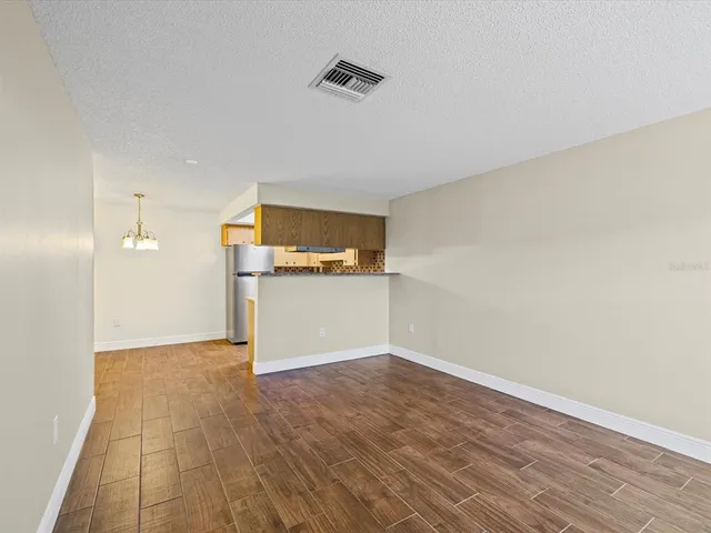 a view of a kitchen with a sink and a microwave