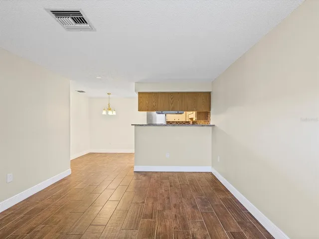 a view of a kitchen with wooden floor