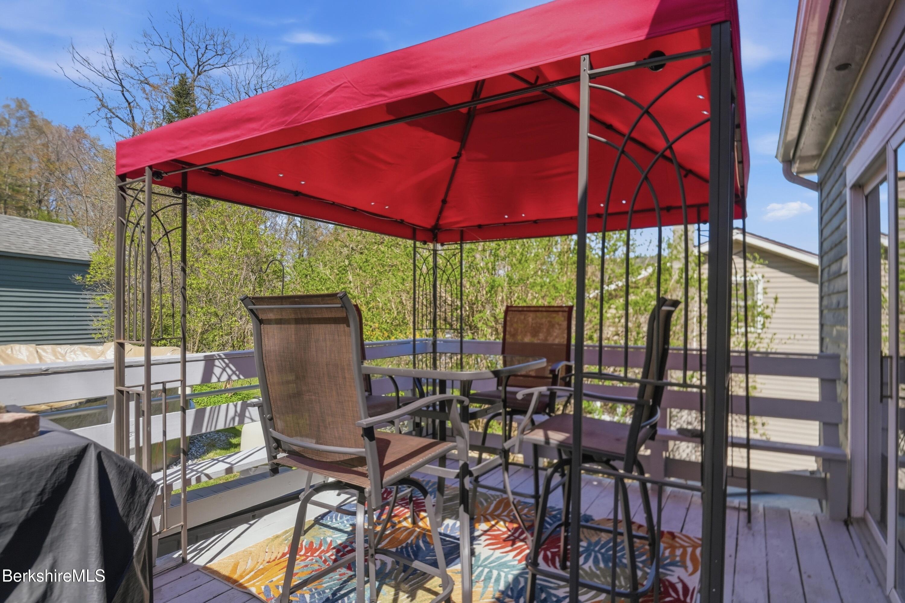 22 Broadway Street Pittsfield, MA 01201 - Photo 73 of 84 a view of balcony with chairs and umbrella