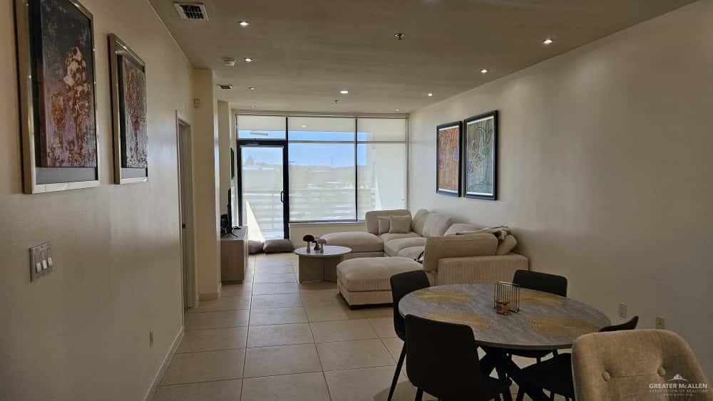813 Travis Street, Unit 210 Mission, TX 78572 - Photo 3 of 13 a living room with furniture and a window