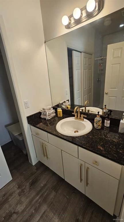 813 Travis Street, Unit 210 Mission, TX 78572 - Photo 6 of 13 a bathroom with a sink and a mirror