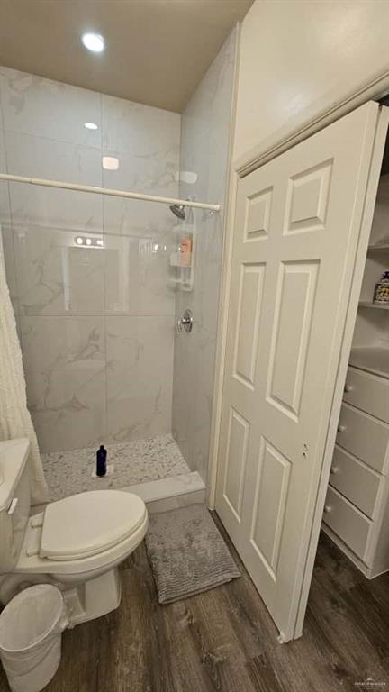 813 Travis Street, Unit 210 Mission, TX 78572 - Photo 7 of 13 a bathroom with a toilet and a shower