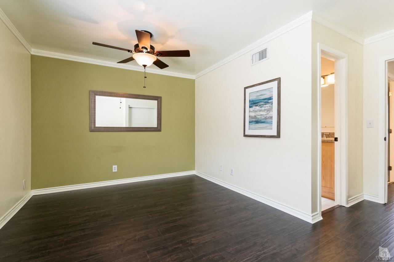 6449 Keystone Street Simi Valley, CA 93063 - Photo 11 of 20 a view of a room with wooden floor ceiling fan