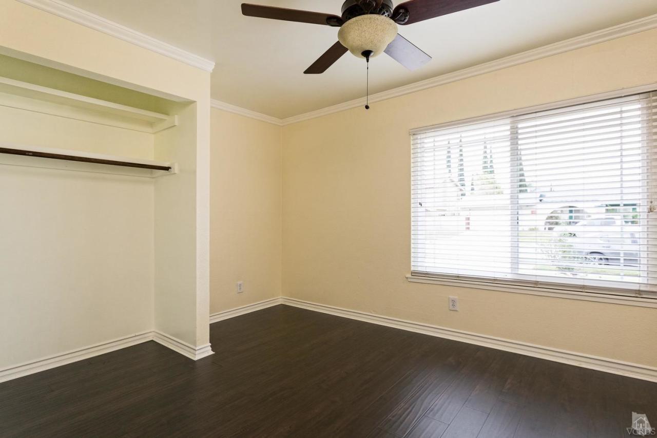 6449 Keystone Street Simi Valley, CA 93063 - Photo 13 of 20 a view of an empty room with wooden floor and a window