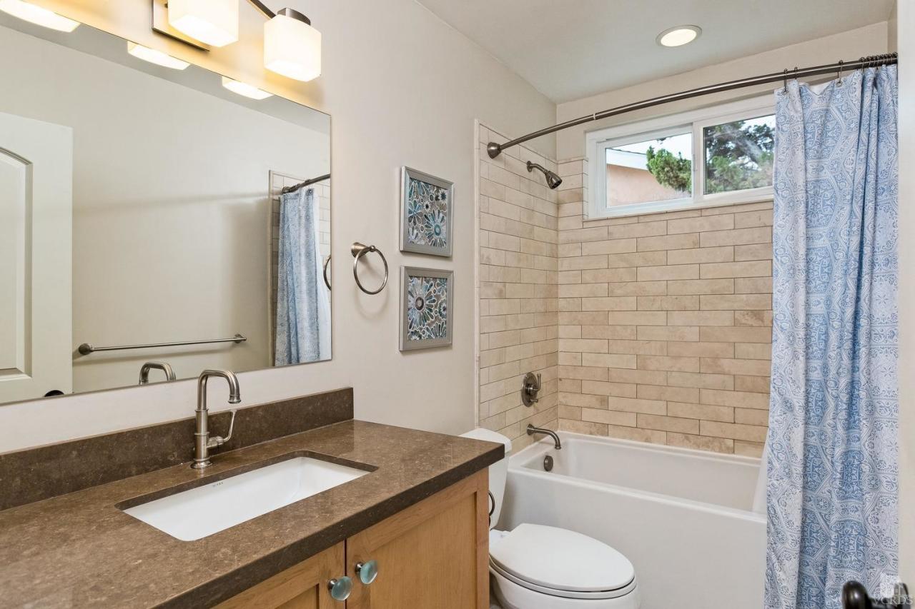 6449 Keystone Street Simi Valley, CA 93063 - Photo 15 of 20 a bathroom with a granite countertop sink toilet and shower