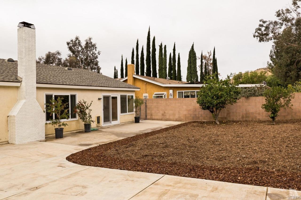 6449 Keystone Street Simi Valley, CA 93063 - Photo 18 of 20 a view of a house with backyard and sitting area