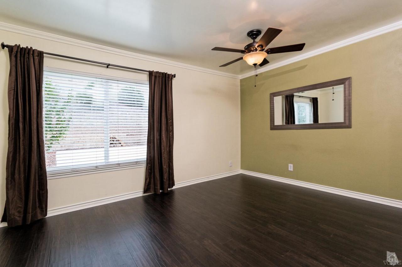 6449 Keystone Street Simi Valley, CA 93063 - Photo 10 of 20 a view of empty room with wooden floor and fan