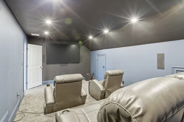 a bedroom with a bed and chair