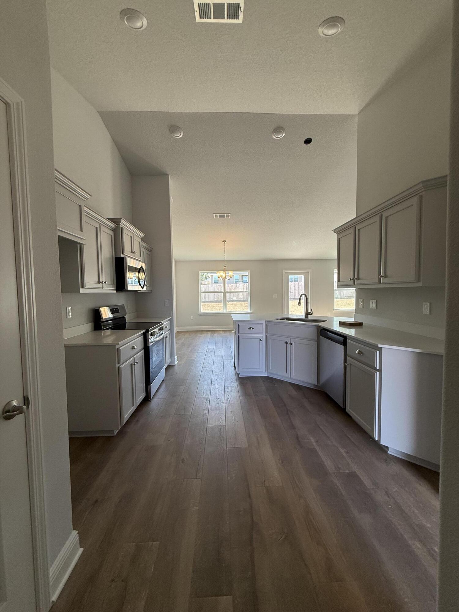 6013 Crocket Cove Crestview, FL 32539 - Photo 17 of 27 a view of kitchen with sink and wooden floor