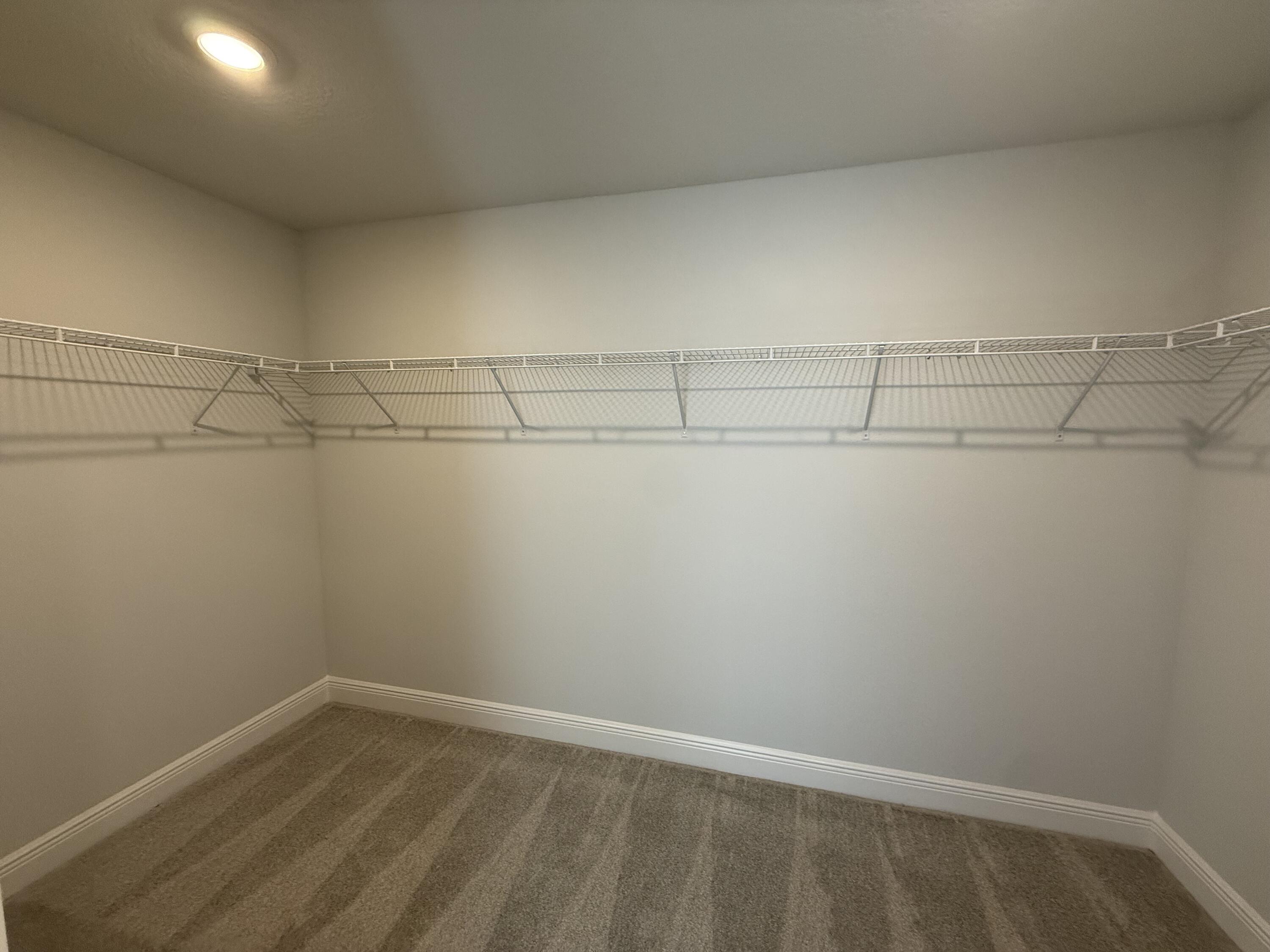 6013 Crocket Cove Crestview, FL 32539 - Photo 25 of 27 a view of a room with racks on the wall