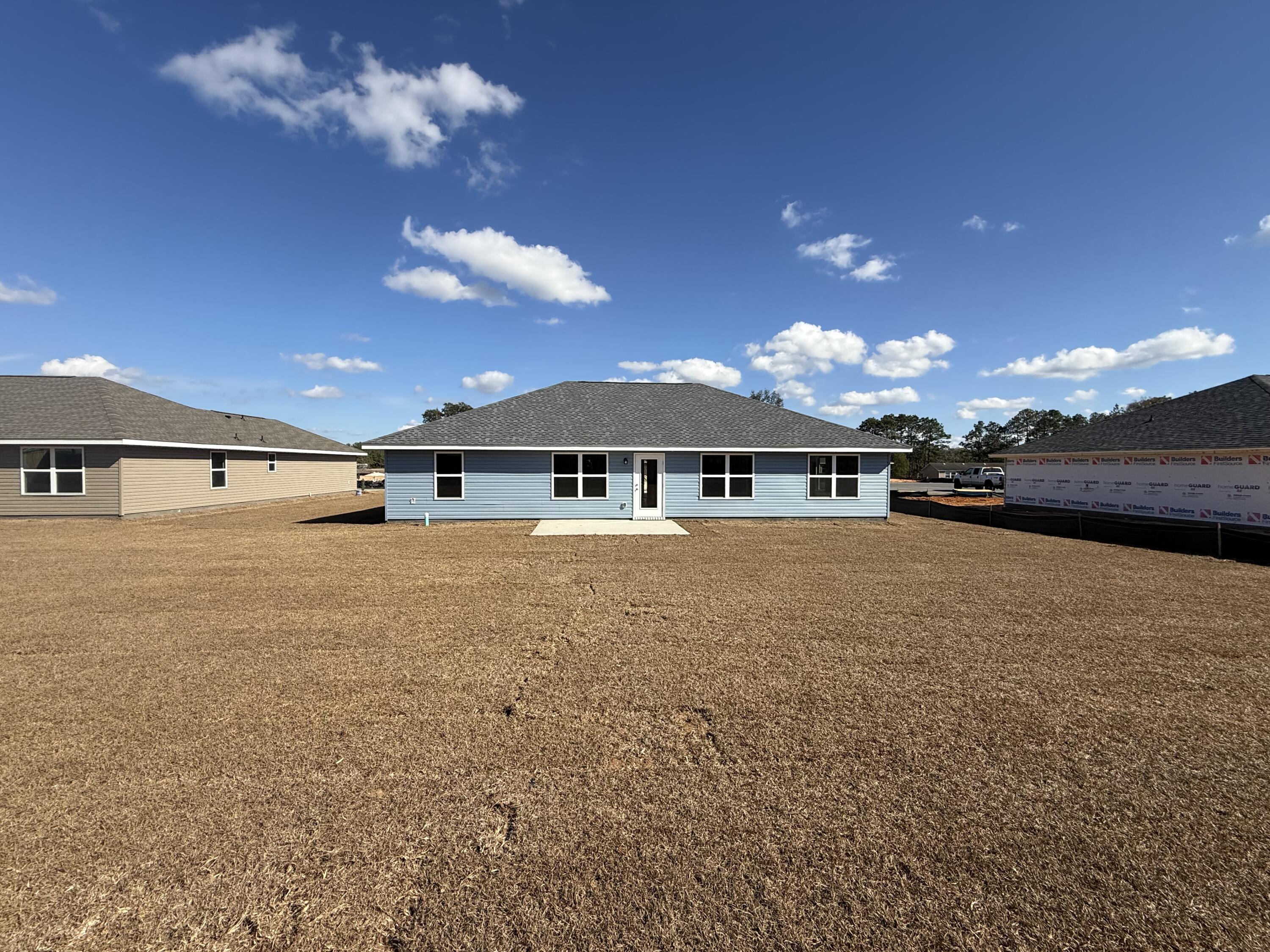 6013 Crocket Cove Crestview, FL 32539 - Photo 27 of 27 a view of a house with a yard