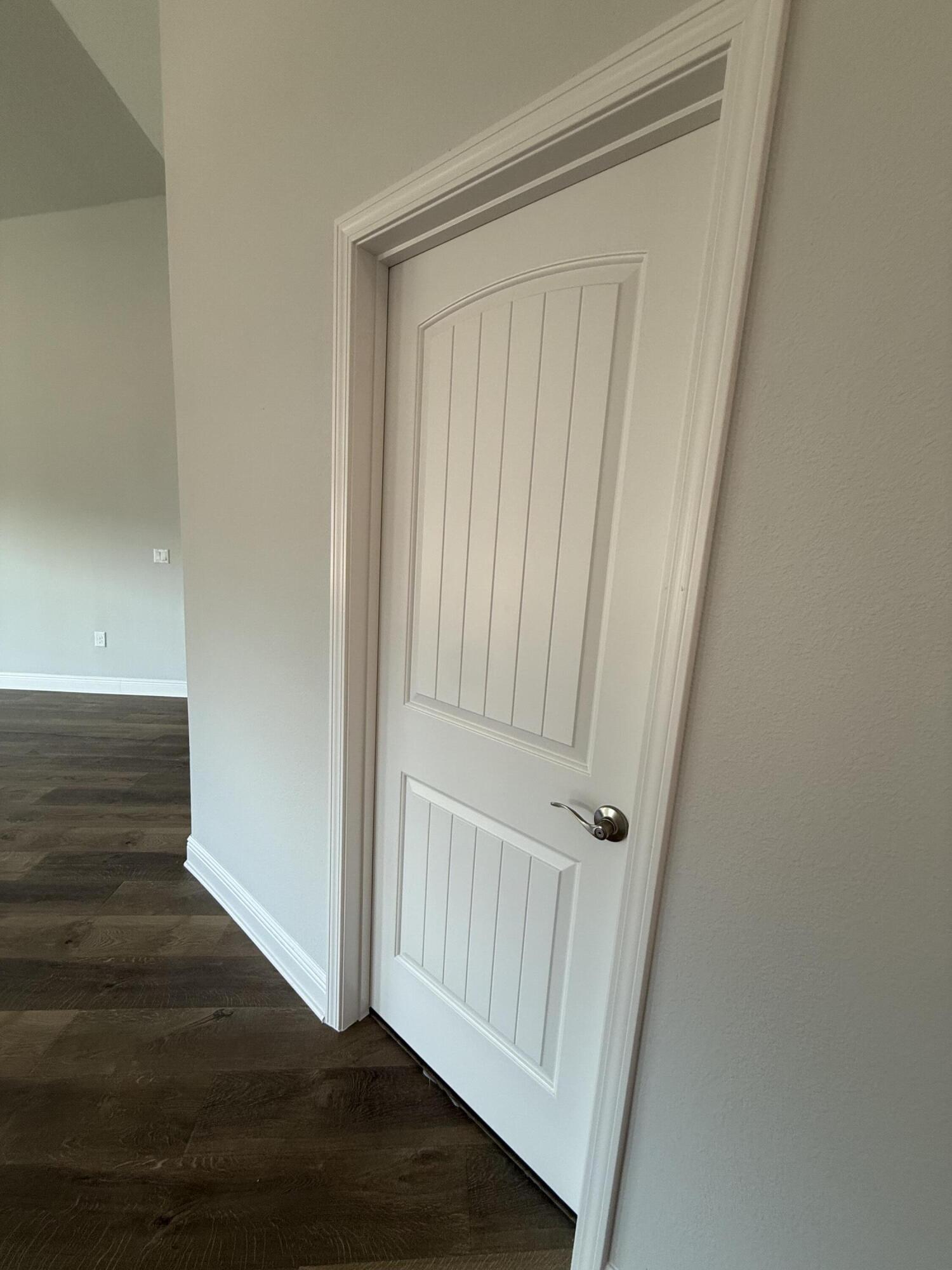 6013 Crocket Cove Crestview, FL 32539 - Photo 6 of 27 an empty room with wooden floor