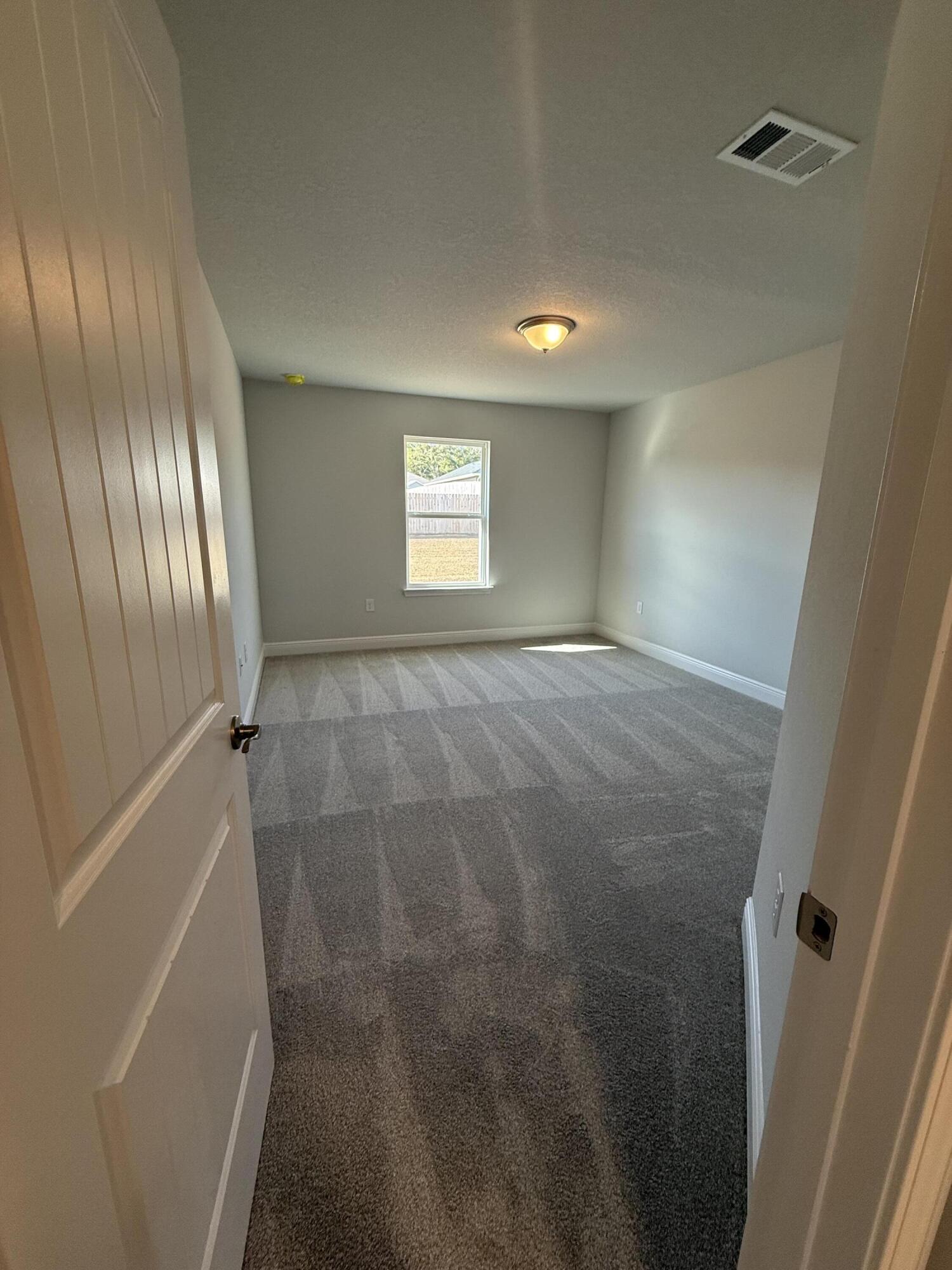 6013 Crocket Cove Crestview, FL 32539 - Photo 8 of 27 a view of an empty room