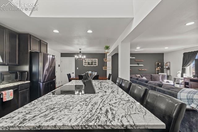 28079 Iris Road Pueblo, CO 81006 - Photo 17 of 50 Dining space with a chandelier