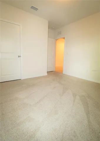 an empty room with a empty space and a window