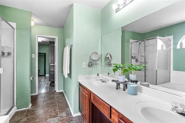 a bathroom with a bathtub and a shower