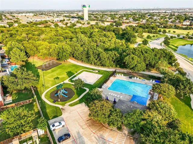 an aerial view of a pool yard swimming pool and outdoor seating