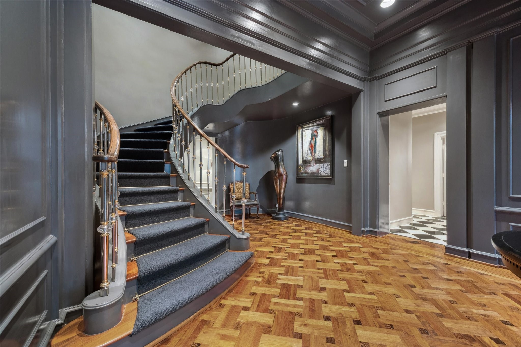 20 Sunset Boulevard Houston, TX 77005 - Photo 5 of 50 Sweeping staircase with crystal balusters