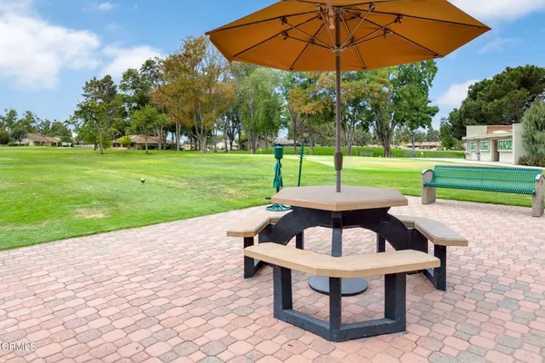 a view of a table and chairs in the garden