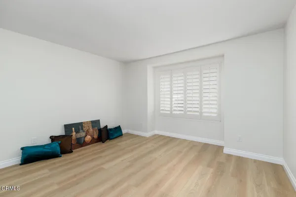 a room with a bed and a window