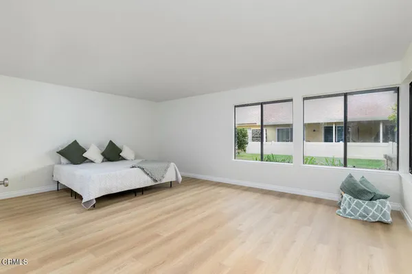a bed room with a bed and a couch