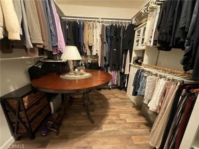 a view of a room with a table and chairs