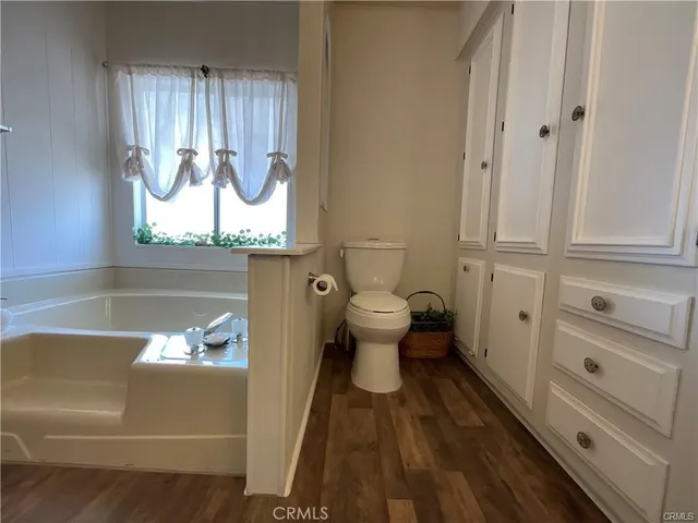 a bathroom with a toilet and a sink
